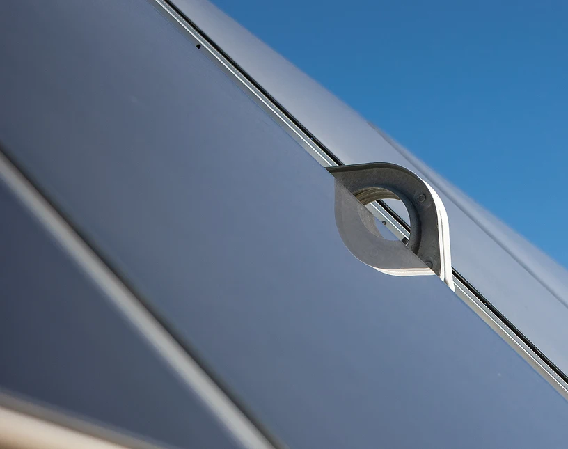 Close-up view of a metallic solar panel handle.